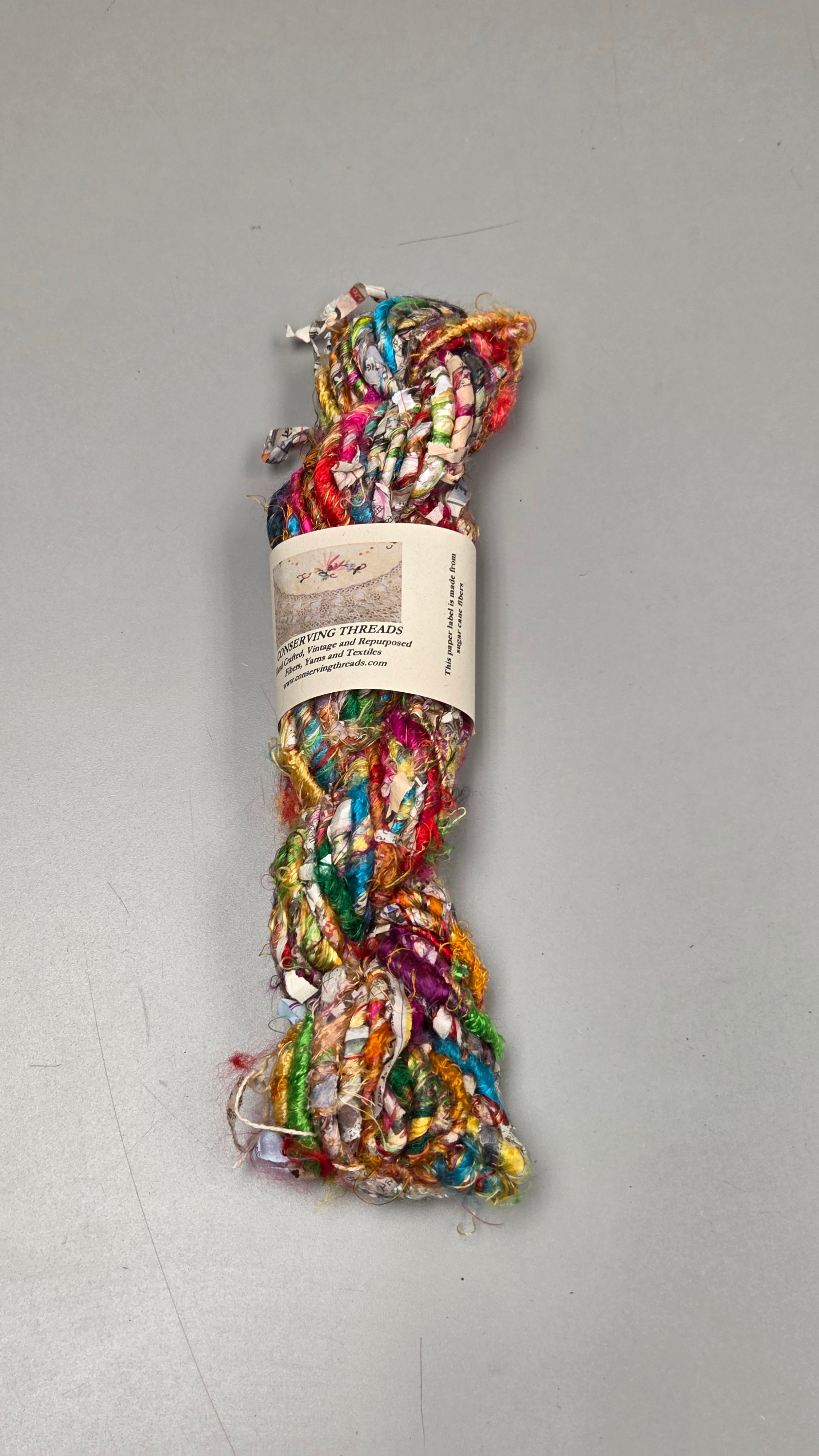 Rainbow Silk and Reclaimed Paper Yarn Skein. Approx. 15 Yards , Newspaper
