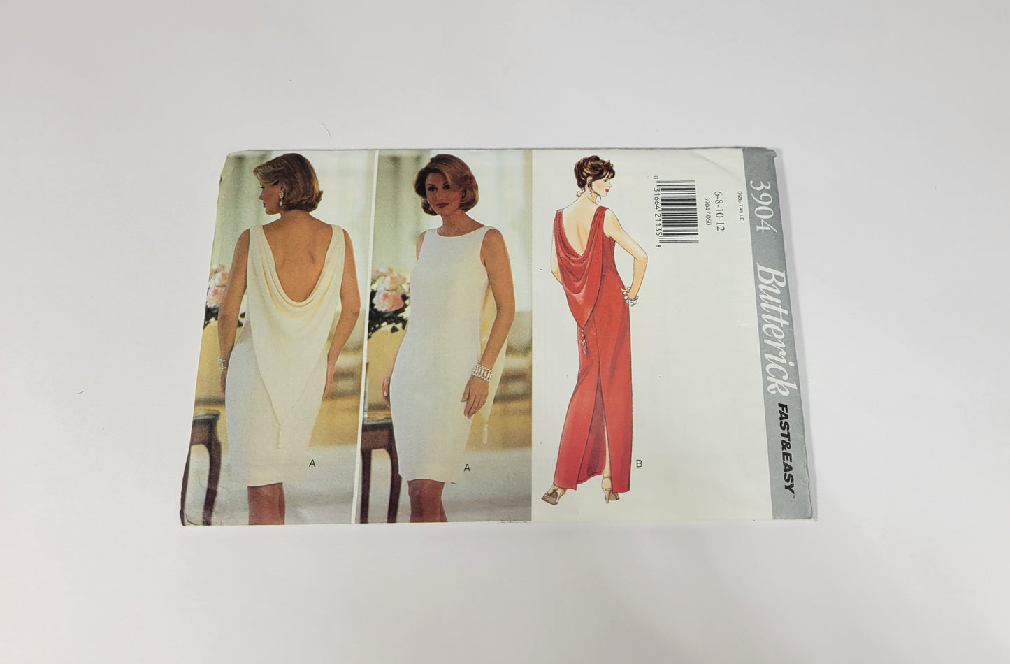 Butterick Pattern 3904, ca 1995. Size 6-8-10-12. Misses' Close-fitting, lined, straight, sleeve - bias, self-lined drape and back zipper.