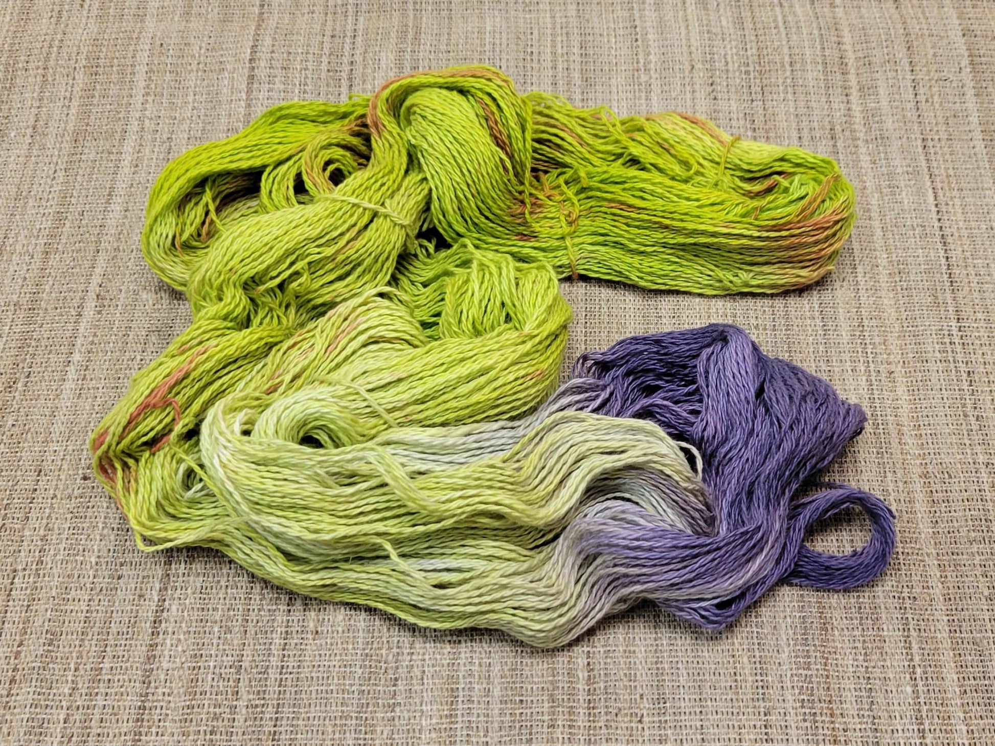 Dyed Cotton / Linen Blend Yarn. Purple, Orange and Green. Fingering Weight. Great for knitting, crochet, and weaving. Assigned Pooling.